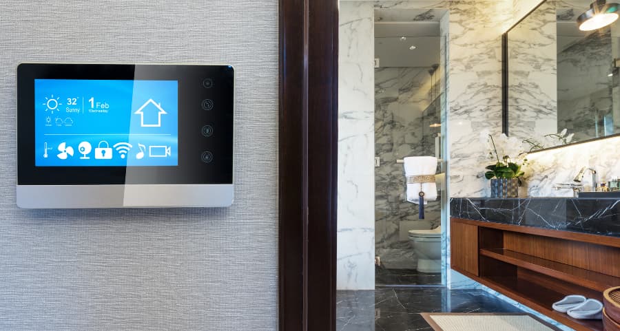 Smart home touchscreen on wall near bathroom